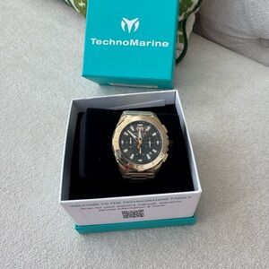 Technomarine Gold Tone Watch with Black Dial and Orange Accents